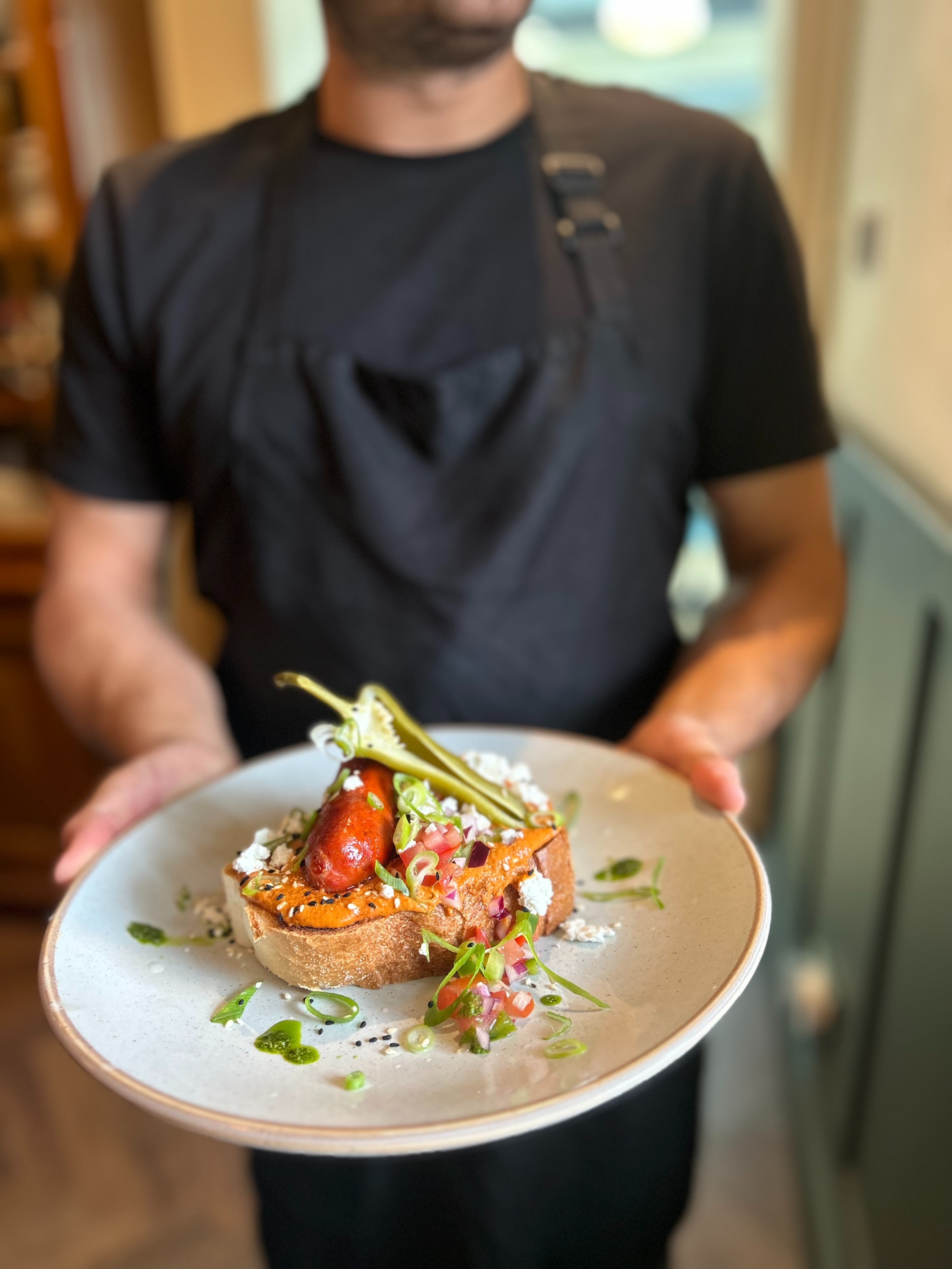 Chef holding brunch dish